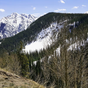 A photo of the Rockies with snow.